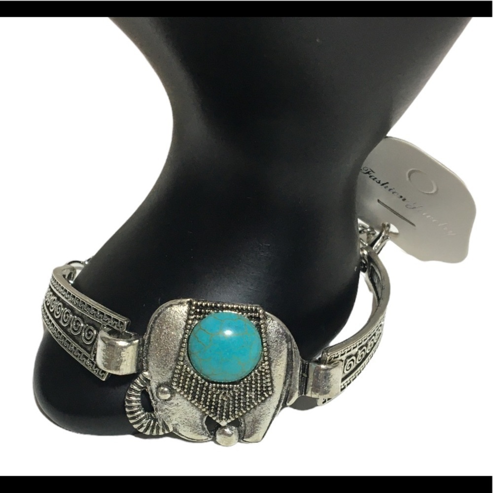 Bohemian style silver bracelet with elephant with trunk up and blue stone